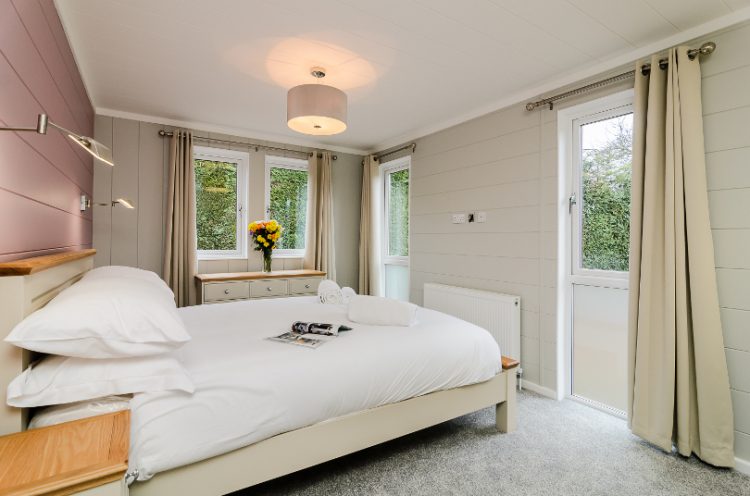 Interior of a double bedroom in a lodge at Canterbury Reach