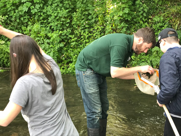 Group of people netting in the Newton Brook