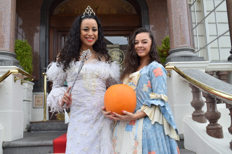 Cinderella and the Fairy Godmother posing for a photo