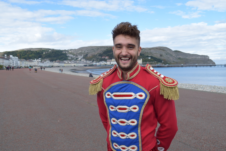 Tom Parker as Prince Charming posing for a photo