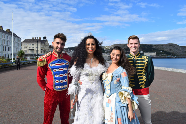 The Cinderella cast posing for a photo on the promenade