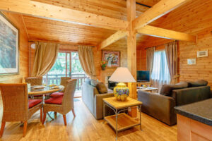 Interior shot of an open plan living area in a lodge at Tilford Woods