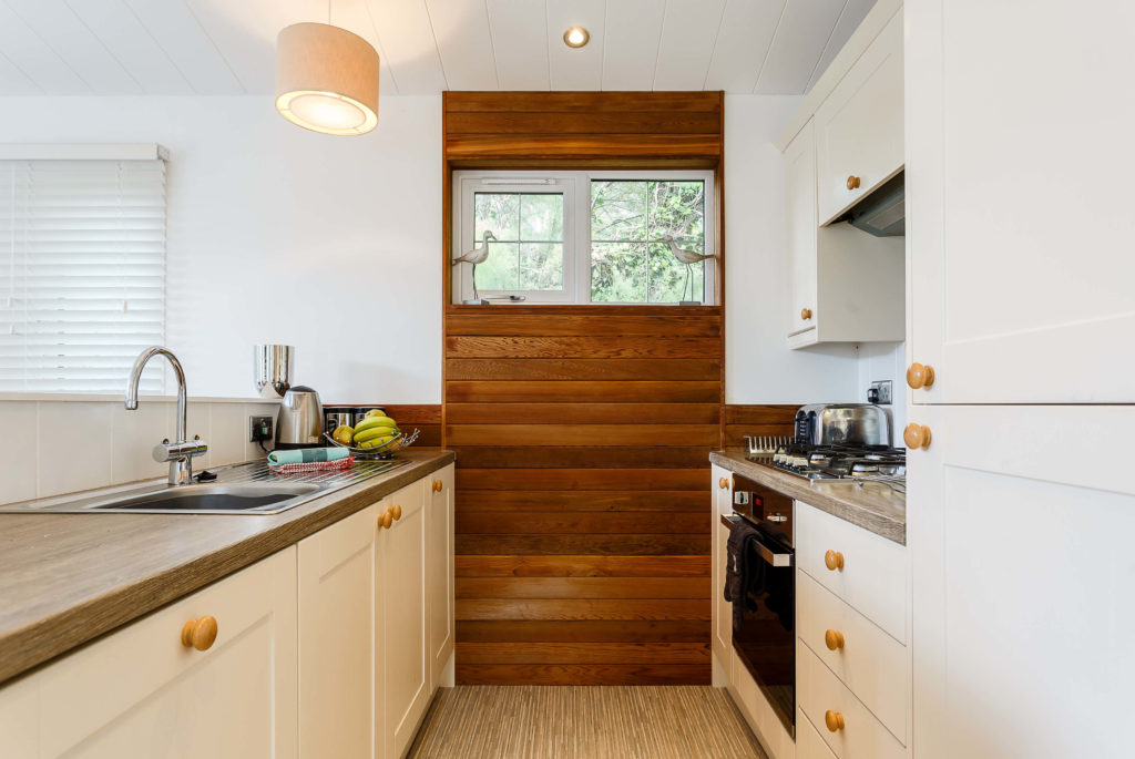 Interior shot of a kitchen in a lodge at Mullion Cove