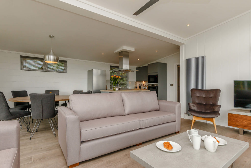 Interior shot of the open plan living area in a Cheddar Lodge