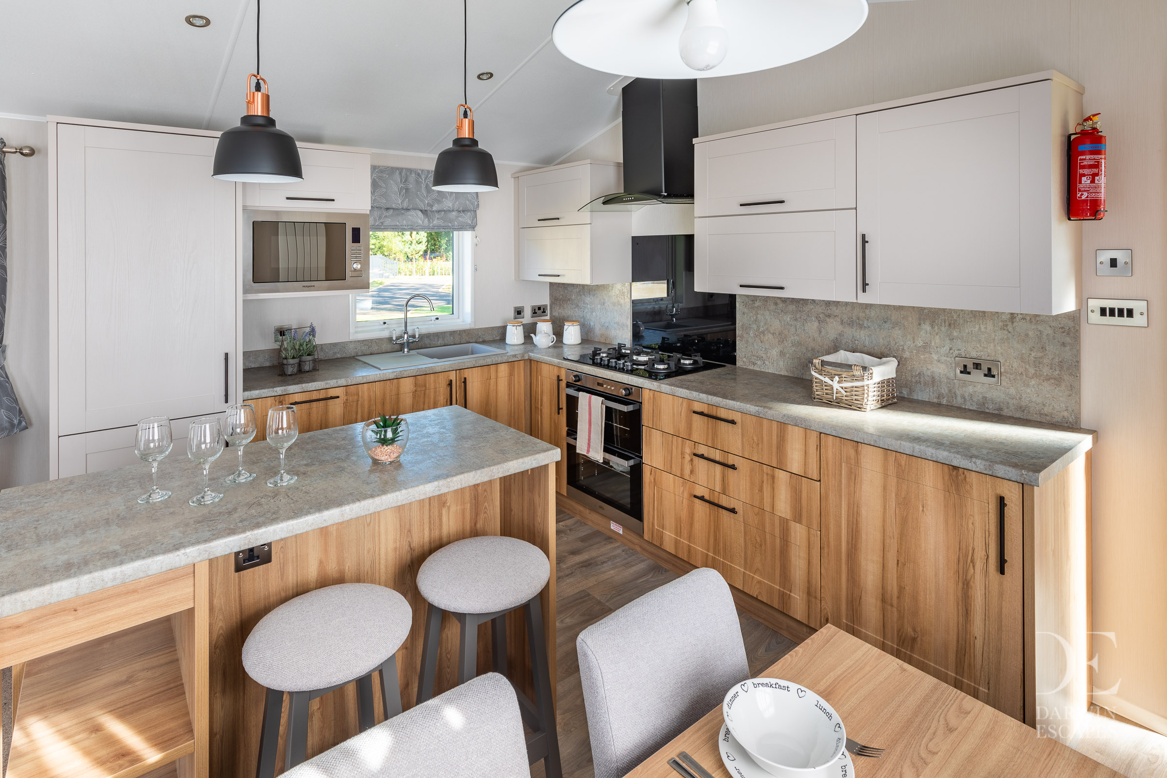 View of the kitchen in the Willerby Waverley with breakfast bar and dining table