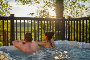 couple sat in a hot tub at Norfolk Woods