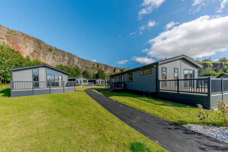 holiday lodges with quarry backdrop in rivendale