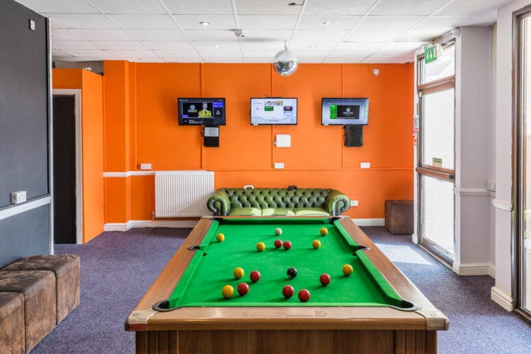 pool table and tvs at new pines