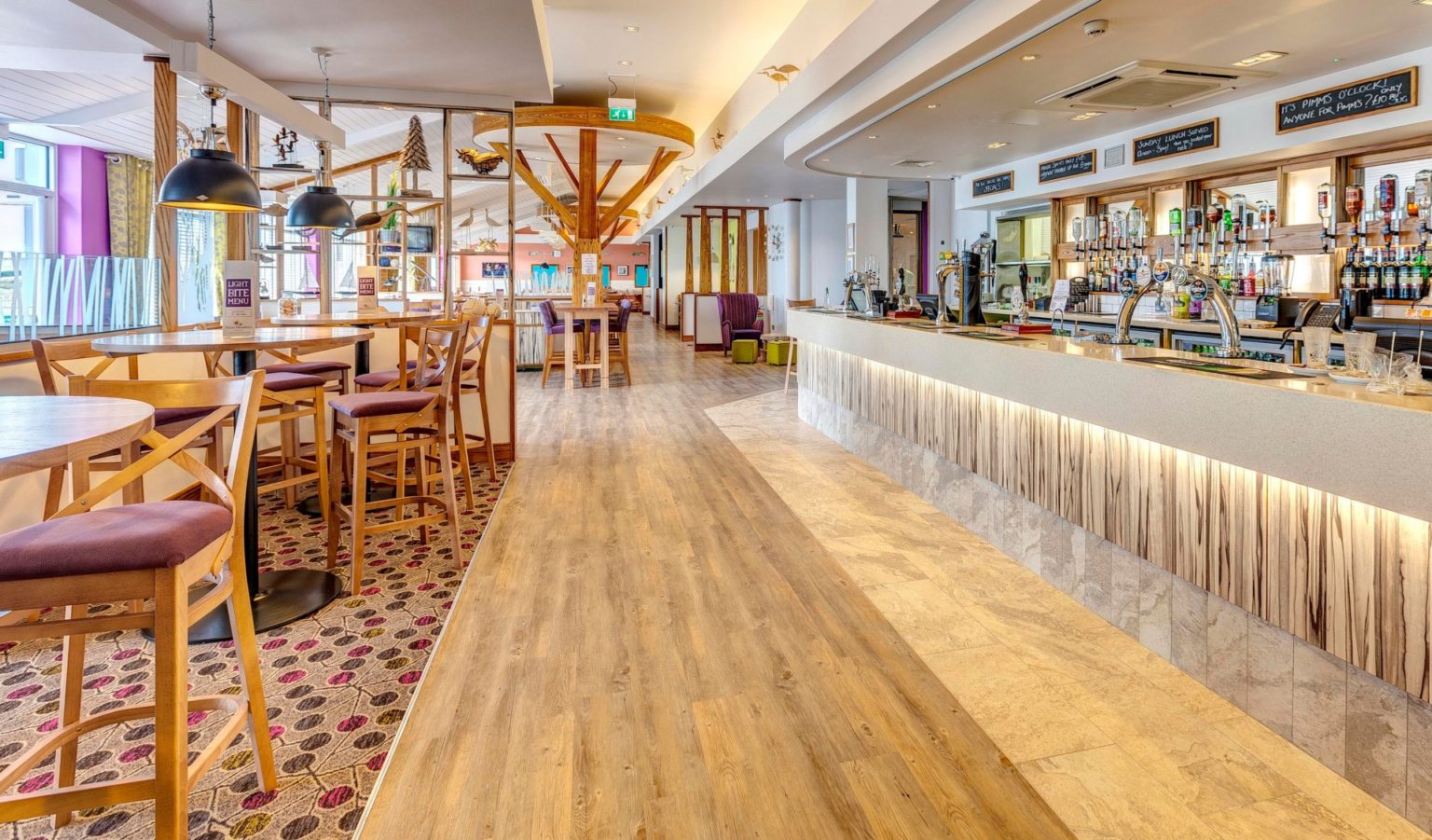 piran meadows bar and bistro. modern interior with tables and chairs