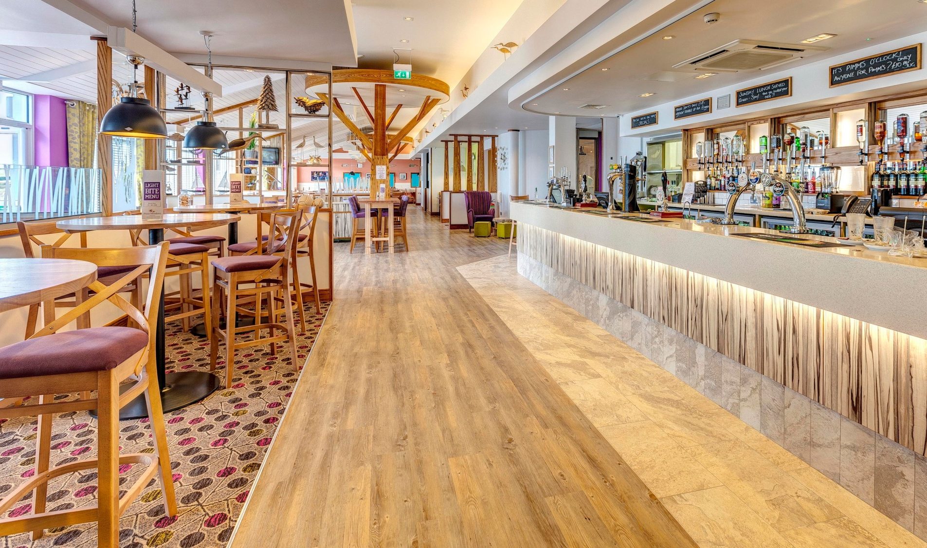 piran meadows bar and bistro. modern interior with tables and chairs