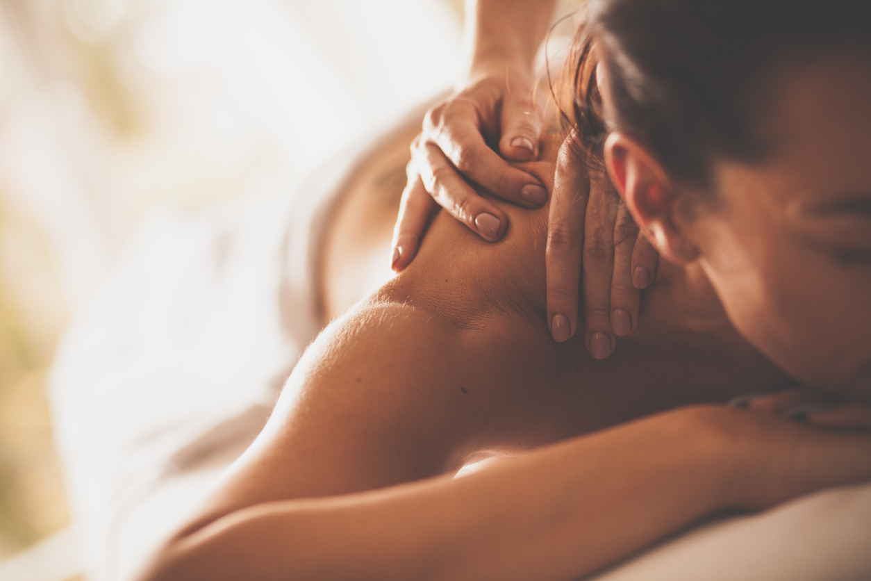 Woman relaxing and enjoying a back massage.